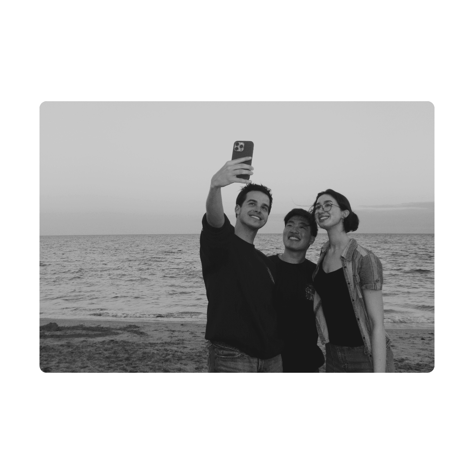 Doox members taking a selfie by the ocean
